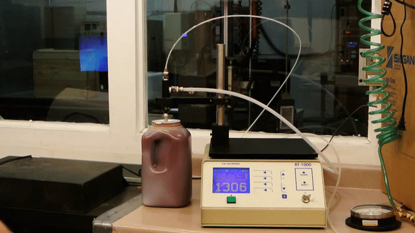 Animated image of a heavy gauge bottle seal puncture test.