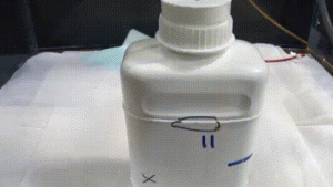 Animated image of pressurized bottle leak testing.